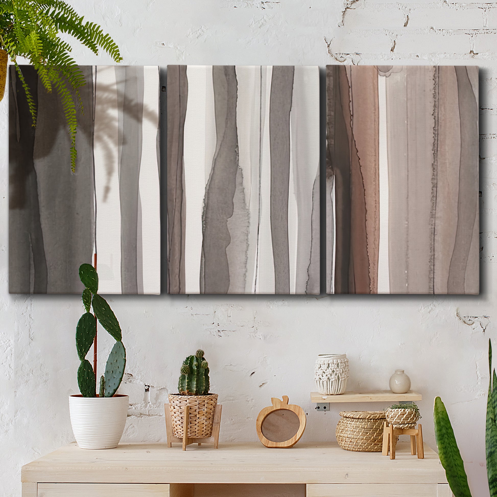 Three-panel canvas wall art featuring riverbank landscape with reflections, displayed in a boho-chic entryway above a console table.