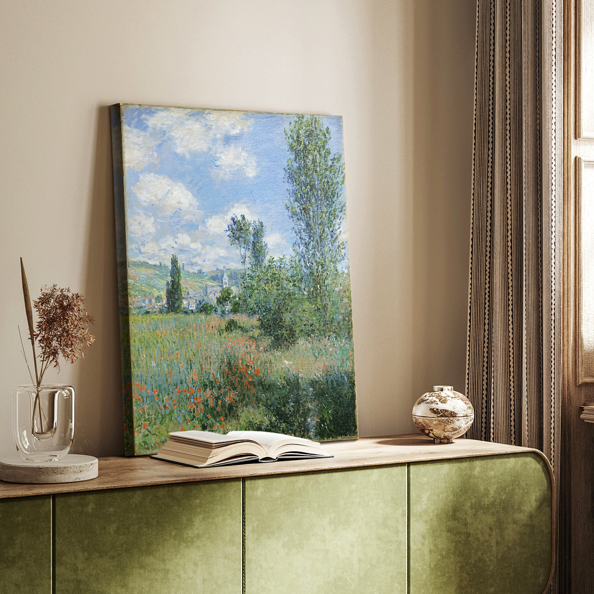Canvas art print of a riverside village scene with gentle brushwork and greenery styled in a home decor setting.