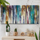 Three-panel canvas wall art featuring abstract shifting color forms, displayed in a boho-chic entryway above a console table.