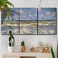 Three-panel canvas wall art featuring rough sea with crashing waves, displayed in a boho-chic entryway above a console table.