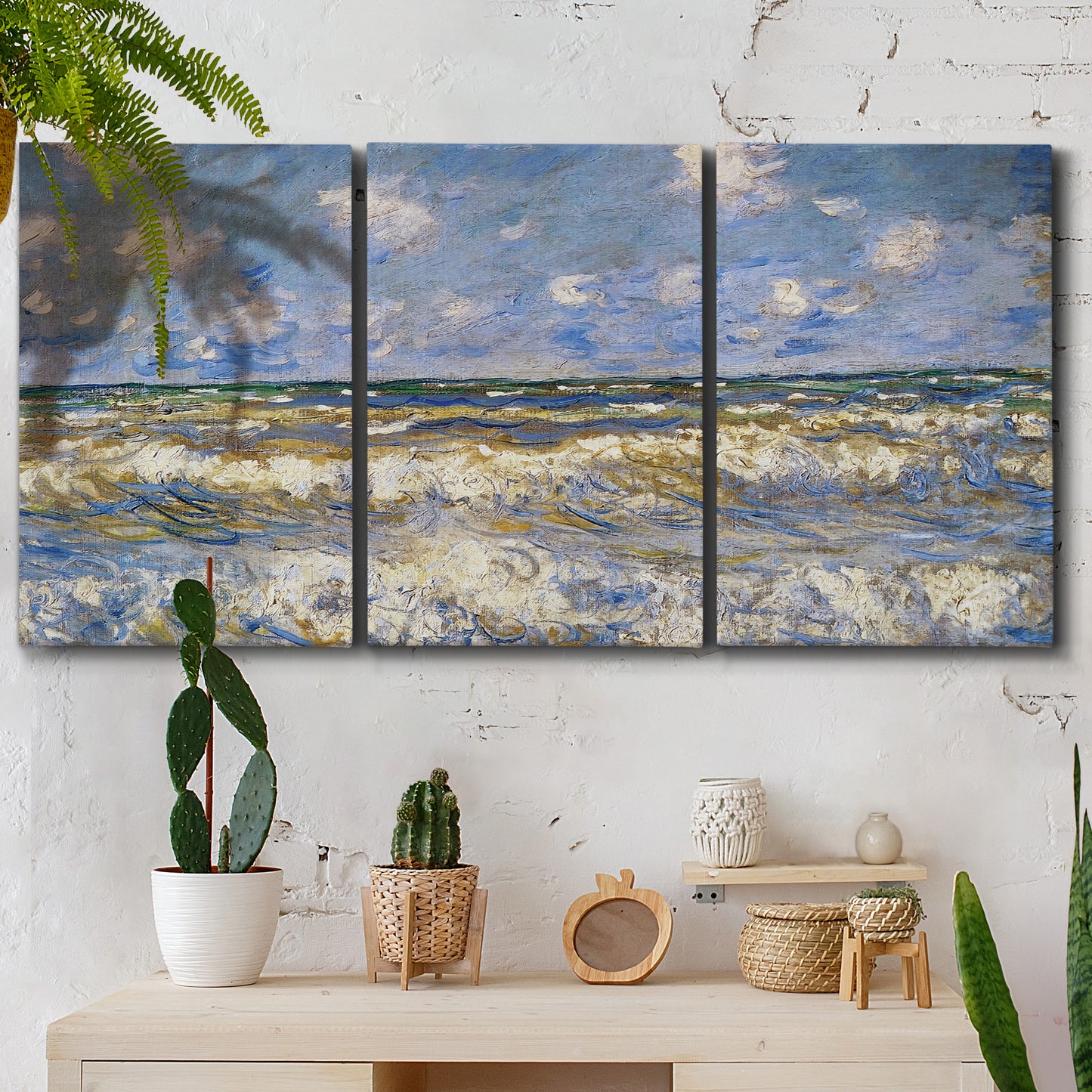 Three-panel canvas wall art featuring rough sea with crashing waves, displayed in a boho-chic entryway above a console table.