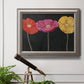 Contemporary poppy flower artwork in an ornate vintage silver frame displayed in a light-toned interior setting.