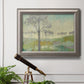 Traditional watercolor tree landscape artwork in an ornate vintage silver frame displayed in a light-toned interior setting.