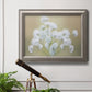 Botanical baby’s breath flower photography in an ornate vintage silver frame displayed in a light-toned interior setting.