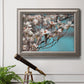 Color-rich dogwood floral photography in an ornate vintage silver frame displayed in a light-toned interior setting.
