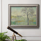 Classical watercolor landscape with trees in an ornate vintage silver frame displayed in a light-toned interior setting.