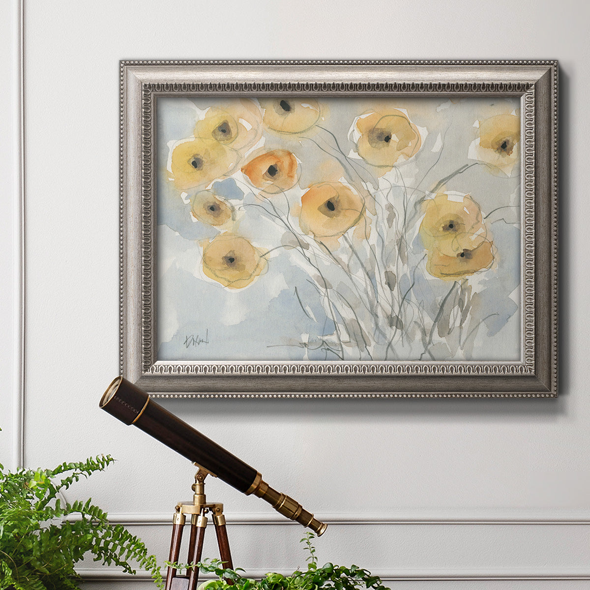 Impressionist poppy floral watercolor painting in an ornate vintage silver frame displayed in a light-toned interior setting.