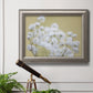 Minimal floral baby’s breath photography in an ornate vintage silver frame displayed in a light-toned interior setting.