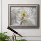 White floral photography close-up in an ornate vintage silver frame displayed in a light-toned interior setting.