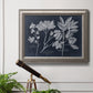 Vintage botanical leaf illustration on dark background in an ornate vintage silver frame displayed in a light-toned interior setting.