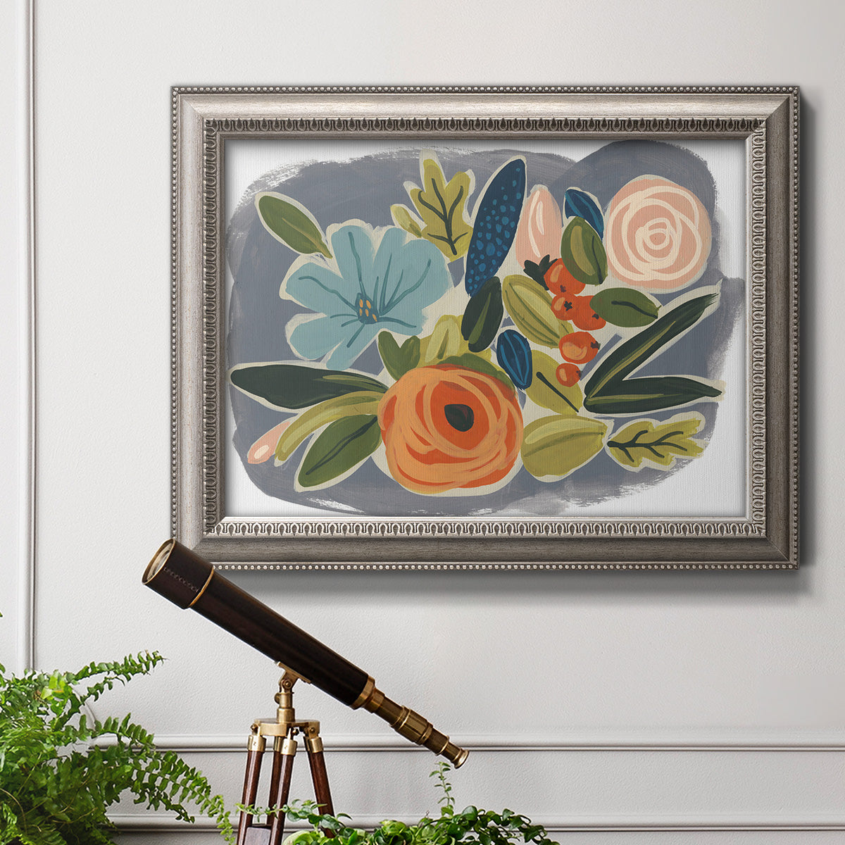 Bold modern botanical illustration in an ornate vintage silver frame displayed in a light-toned interior setting.