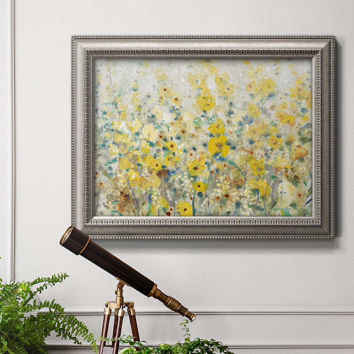 French country floral garden artwork in an ornate vintage silver frame displayed in a light-toned interior setting.