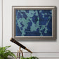 Blue abstract botanical in an ornate vintage silver frame displayed in a light-toned interior setting.