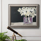 Modern abstract white floral watercolor artwork in an ornate vintage silver frame displayed in a light-toned interior setting.