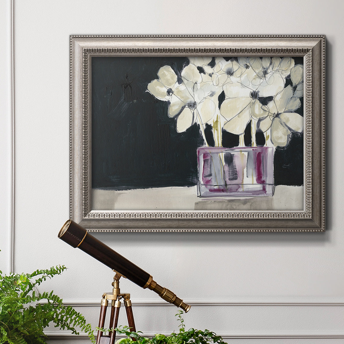 Modern abstract white floral watercolor artwork in an ornate vintage silver frame displayed in a light-toned interior setting.