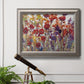 French country floral bouquet painting in an ornate vintage silver frame displayed in a light-toned interior setting.