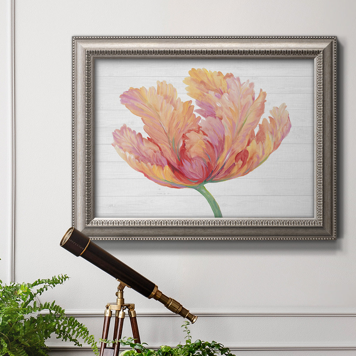 Modern minimalist pink floral artwork in an ornate vintage silver frame displayed in a light-toned interior setting.