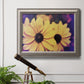 Bright black-eyed Susan flower photography in an ornate vintage silver frame displayed in a light-toned interior setting.