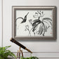Asian-inspired lotus flower illustration in an ornate vintage silver frame displayed in a light-toned interior setting.