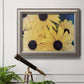 Modern sunflower-style Susan floral photograph in an ornate vintage silver frame displayed in a light-toned interior setting.