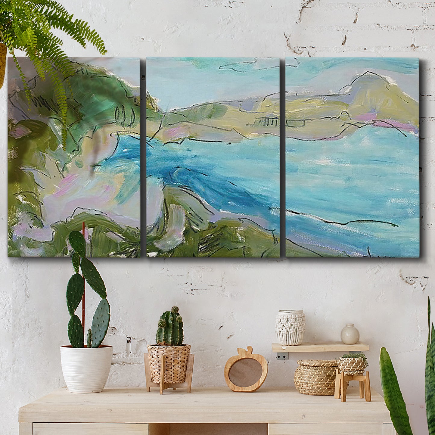 Three-panel canvas wall art featuring open landscape with landing strip, displayed in a boho-chic entryway above a console table.