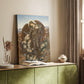 Canvas art print of a dramatic composition with figures lying across a barren field styled in a home decor setting.