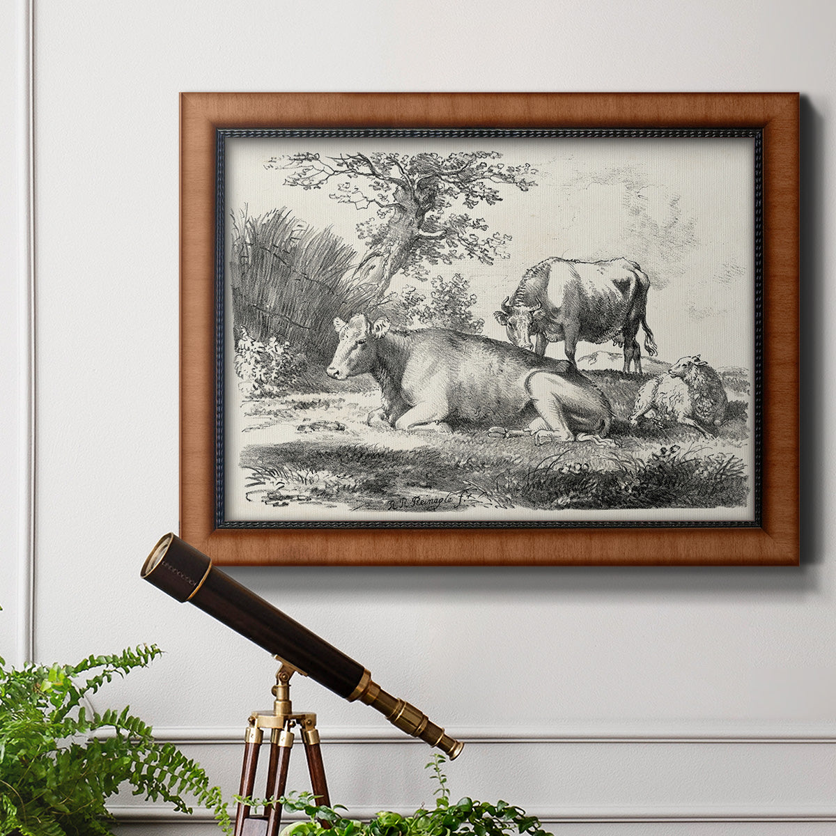 Classical pastoral landscape artwork by Nicolas Berchem in an ornate vintage burl wood frame displayed in a light-toned interior setting.