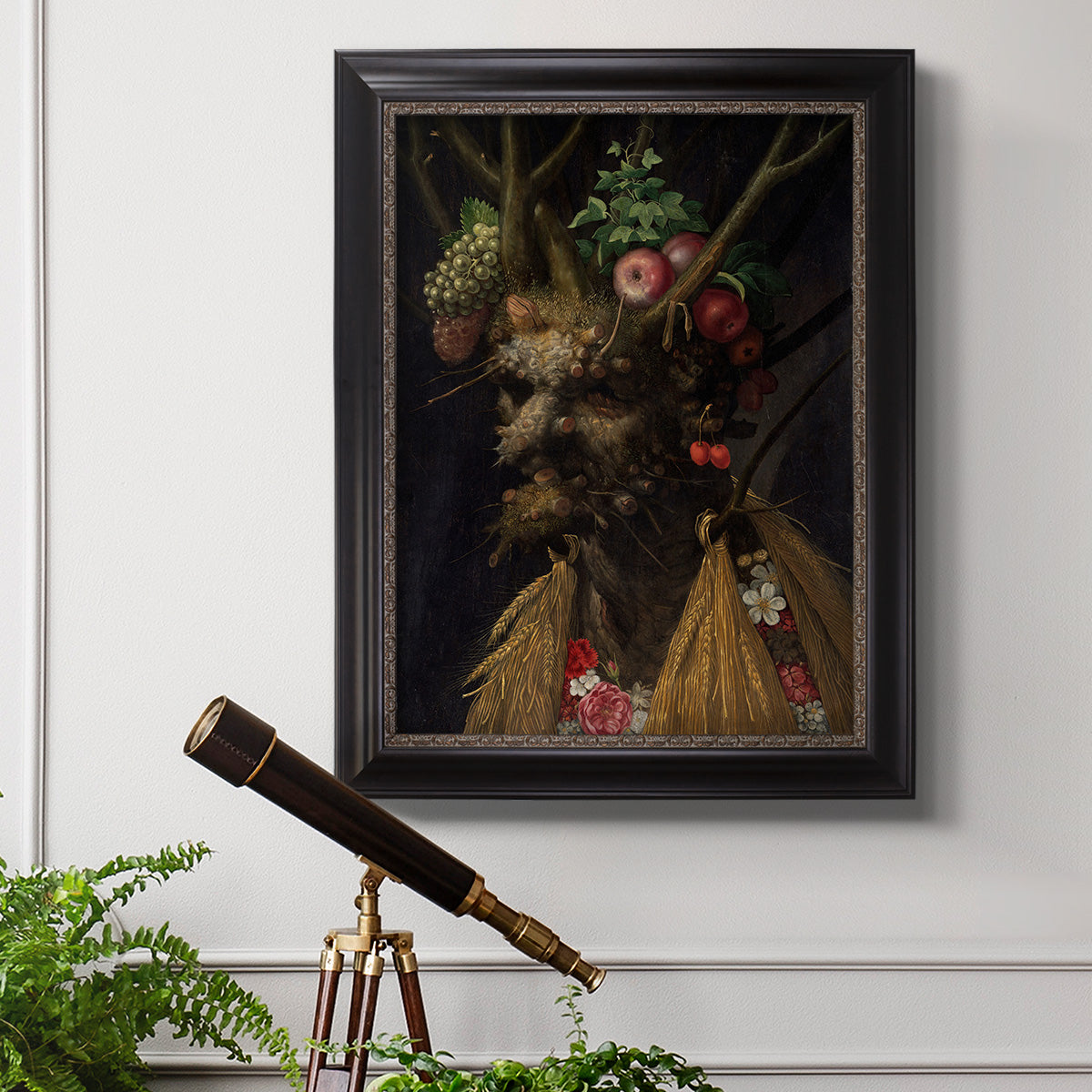 Surreal allegorical portrait representing the four seasons by Giuseppe Arcimboldo in an ornate black frame with gilded inner detail displayed in a light-toned interior setting.
