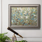 Impressionist flowering vine watercolor artwork in an ornate vintage silver frame displayed in a light-toned interior setting.