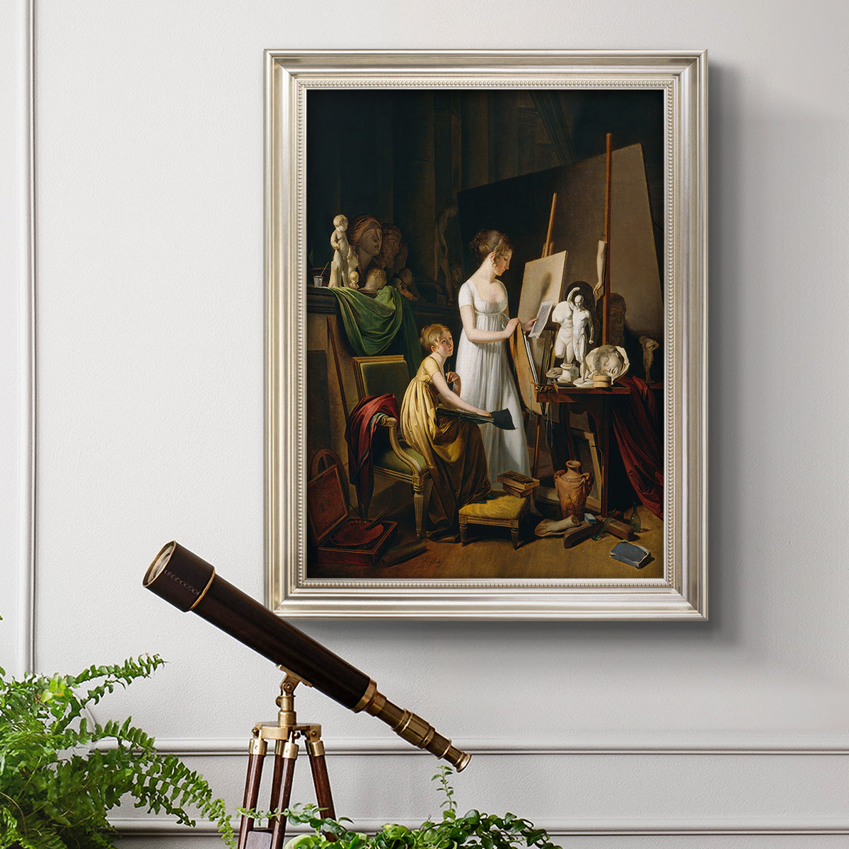 Classical interior painting of an artist at work by Louis-Leopold Boilly in an ornate champagne frame displayed in a light-toned interior setting.