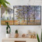 Three-panel canvas wall art featuring three poplar trees beside water, displayed in a boho-chic entryway above a console table.