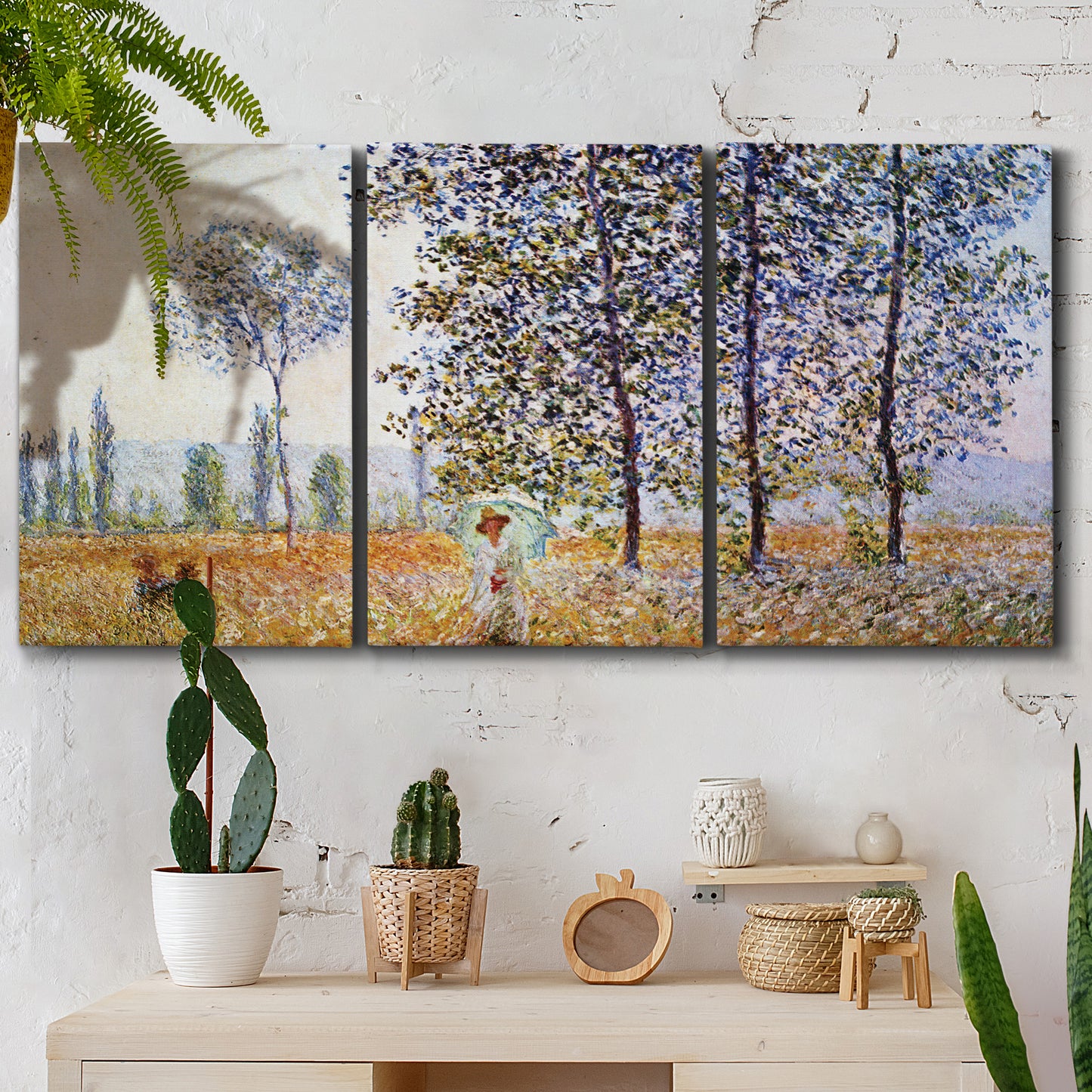 Three-panel canvas wall art featuring three poplar trees beside water, displayed in a boho-chic entryway above a console table.