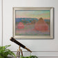 Impressionist haystack series landscape by Claude Monet in an ornate champagne frame displayed in a light-toned interior setting.