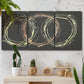 Three-panel canvas wall art featuring geometric abstract wave tangents, displayed in a boho-chic entryway above a console table.