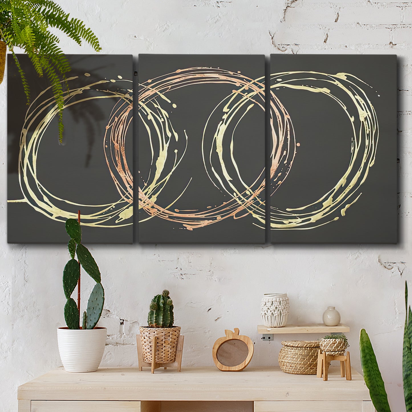 Three-panel canvas wall art featuring geometric abstract wave tangents, displayed in a boho-chic entryway above a console table.