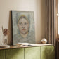 Canvas art print of a delicate head study with light shading and calm features styled in a home decor setting.