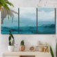 Three-panel canvas wall art featuring vertical coastal elements with rising light, displayed in a boho-chic entryway above a console table.
