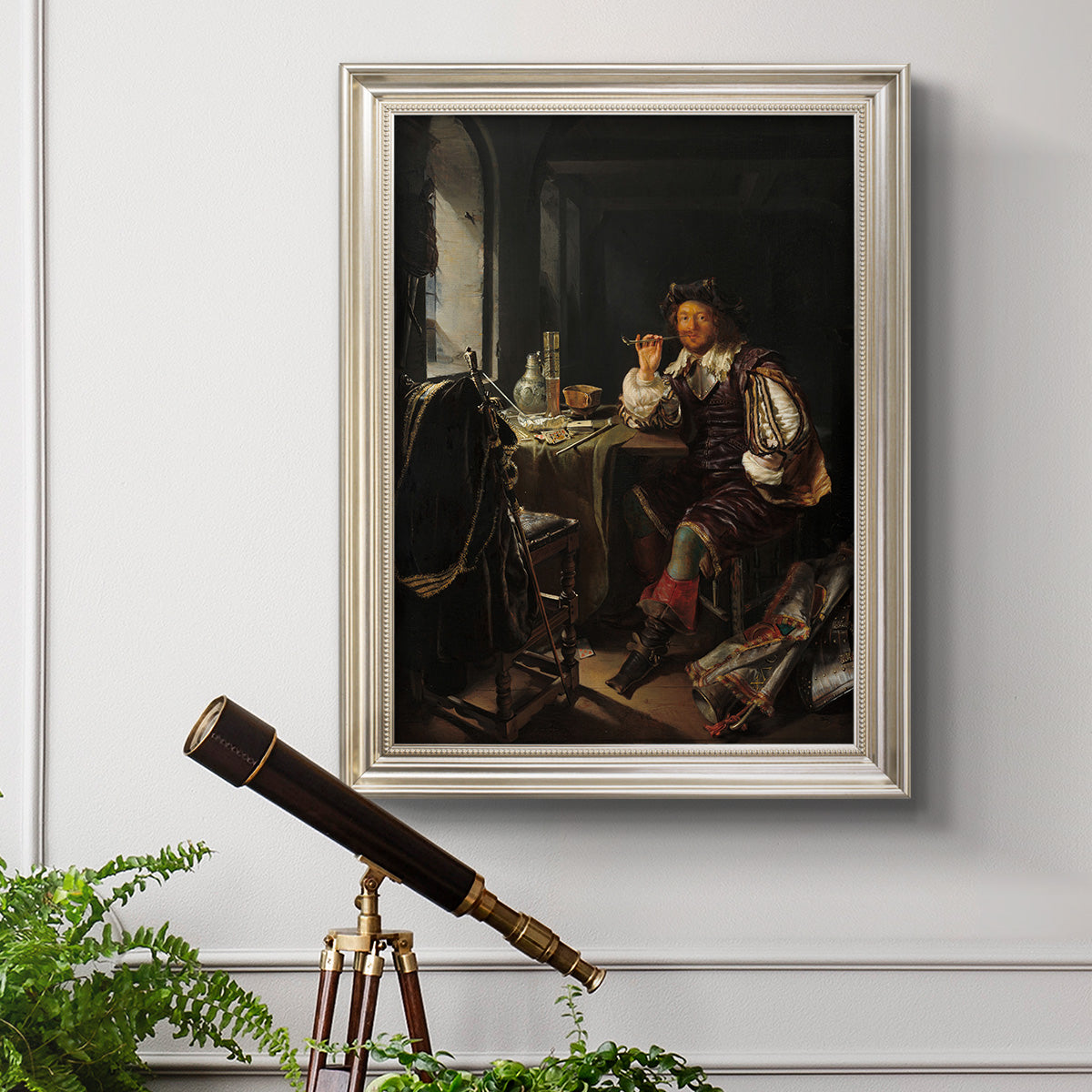 Classical portrait of a soldier smoking a pipe by Frans van Mieris the Elder in an ornate champagne frame displayed in a light-toned interior setting.