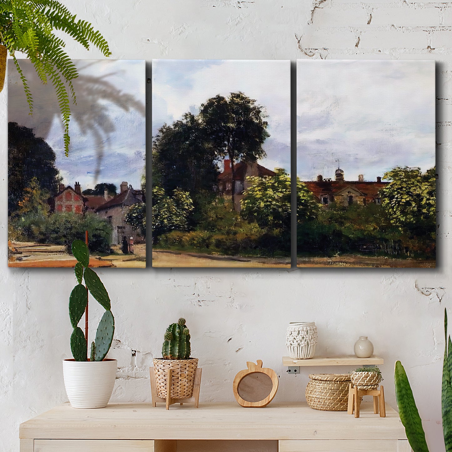 Three-panel canvas wall art featuring garden corner with flowering trees, displayed in a boho-chic entryway above a console table.