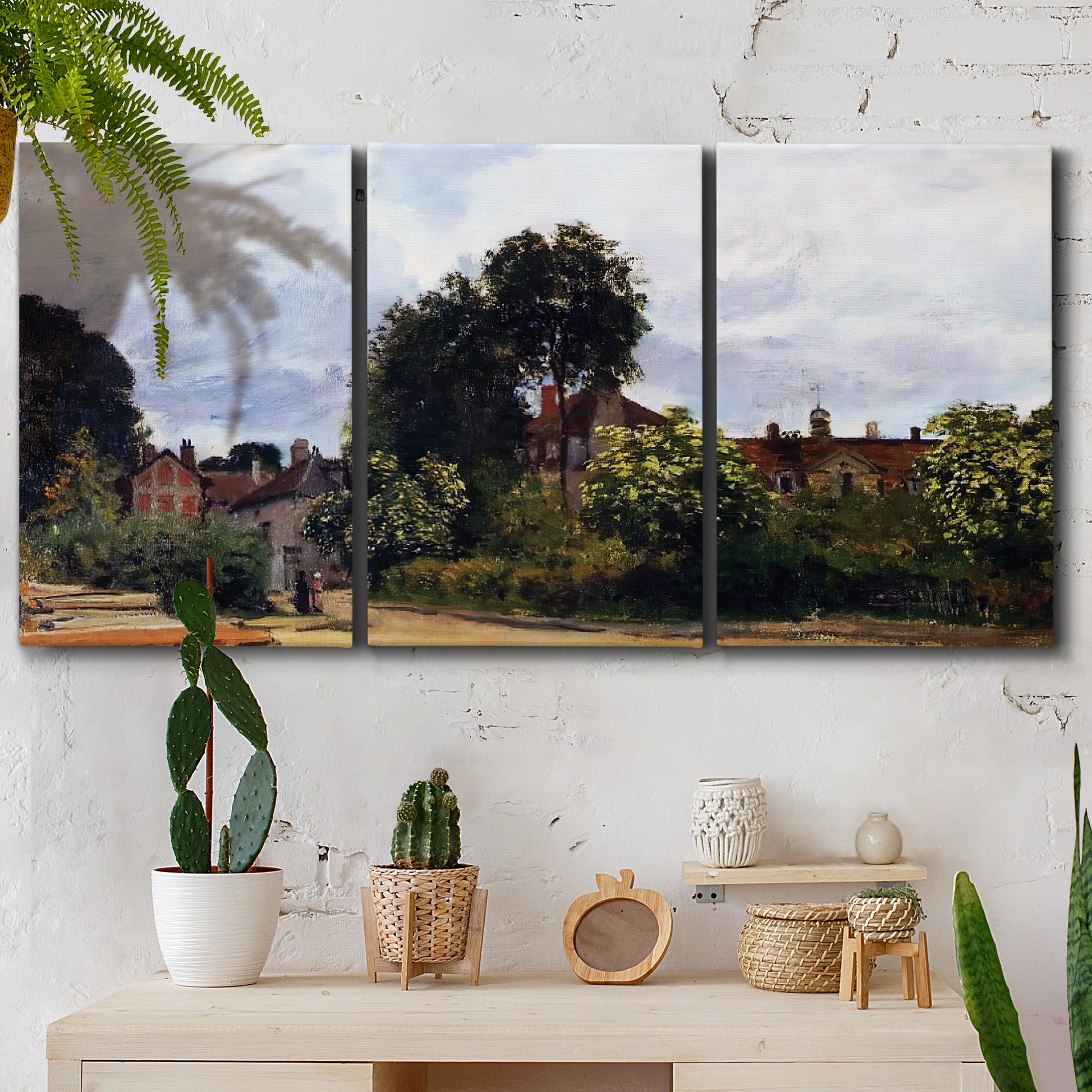 Three-panel canvas wall art featuring garden corner with flowering trees, displayed in a boho-chic entryway above a console table.