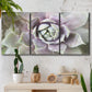 Three-panel canvas wall art featuring close up succulent photography, displayed in a boho-chic entryway above a console table.