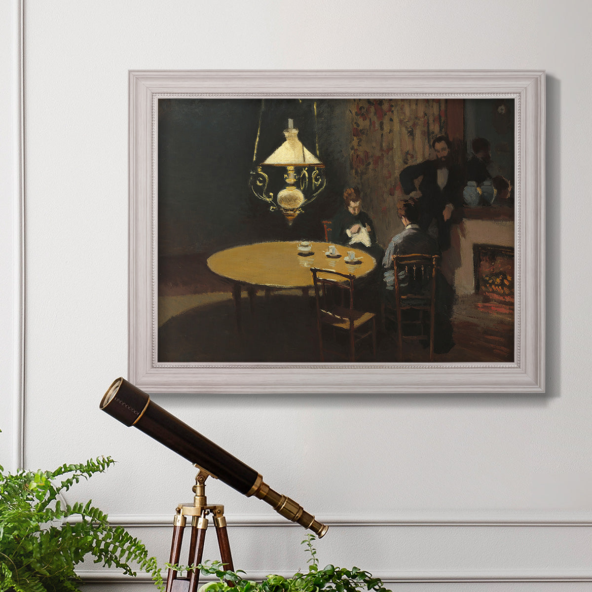 Impressionist domestic interior scene by Claude Monet in an ornate weathered white frame displayed in a light-toned interior setting.