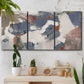 Three-panel canvas wall art featuring cool blue abstract layered composition, displayed in a boho-chic entryway above a console table.
