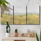 Three-panel canvas wall art featuring pastoral wheat field landscape, displayed in a boho-chic entryway above a console table.