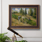 Impressionist countryside harvest scene by Camille Pissarro in an ornate bronzed mahogany wood frame displayed in a light-toned interior setting.