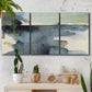 Three-panel canvas wall art featuring abstract watercolor with upward motion, displayed in a boho-chic entryway above a console table.