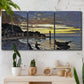 Three-panel canvas wall art featuring river at dusk with fading light, displayed in a boho-chic entryway above a console table.