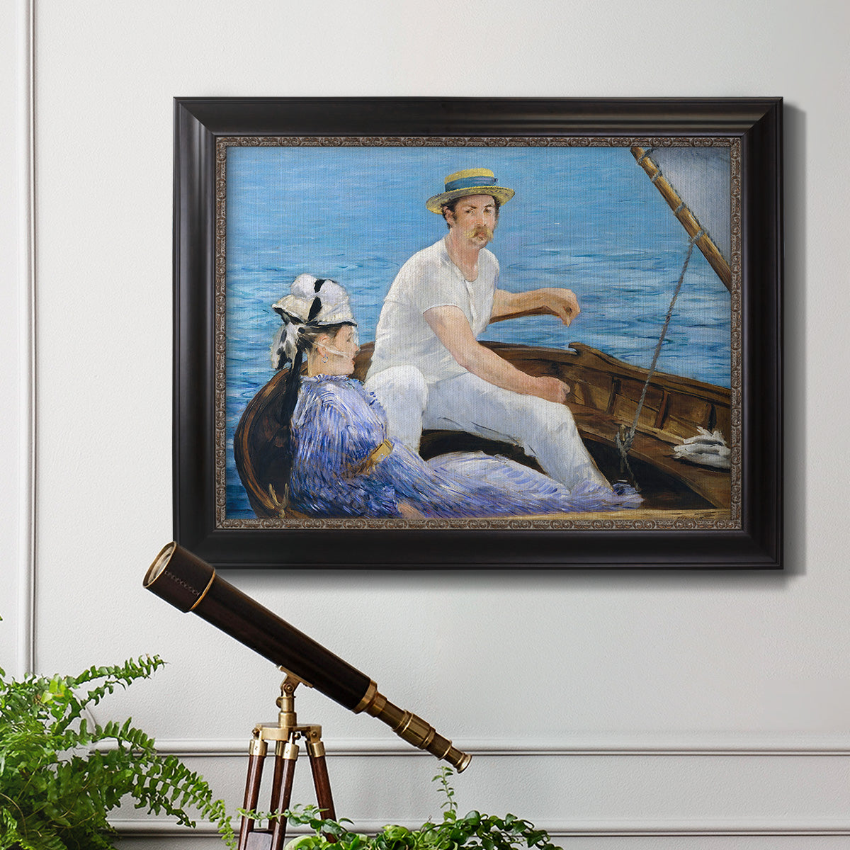 Impressionist leisure boating scene by Édouard Manet in an ornate black frame with gilded inner detail displayed in a light-toned interior setting.
