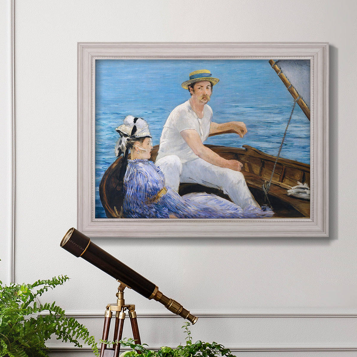 Impressionist leisure boating scene by Édouard Manet in an ornate weathered white frame displayed in a light-toned interior setting.