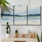 Three-panel canvas wall art featuring soft coastal shoreline landscape, displayed in a boho-chic entryway above a console table.
